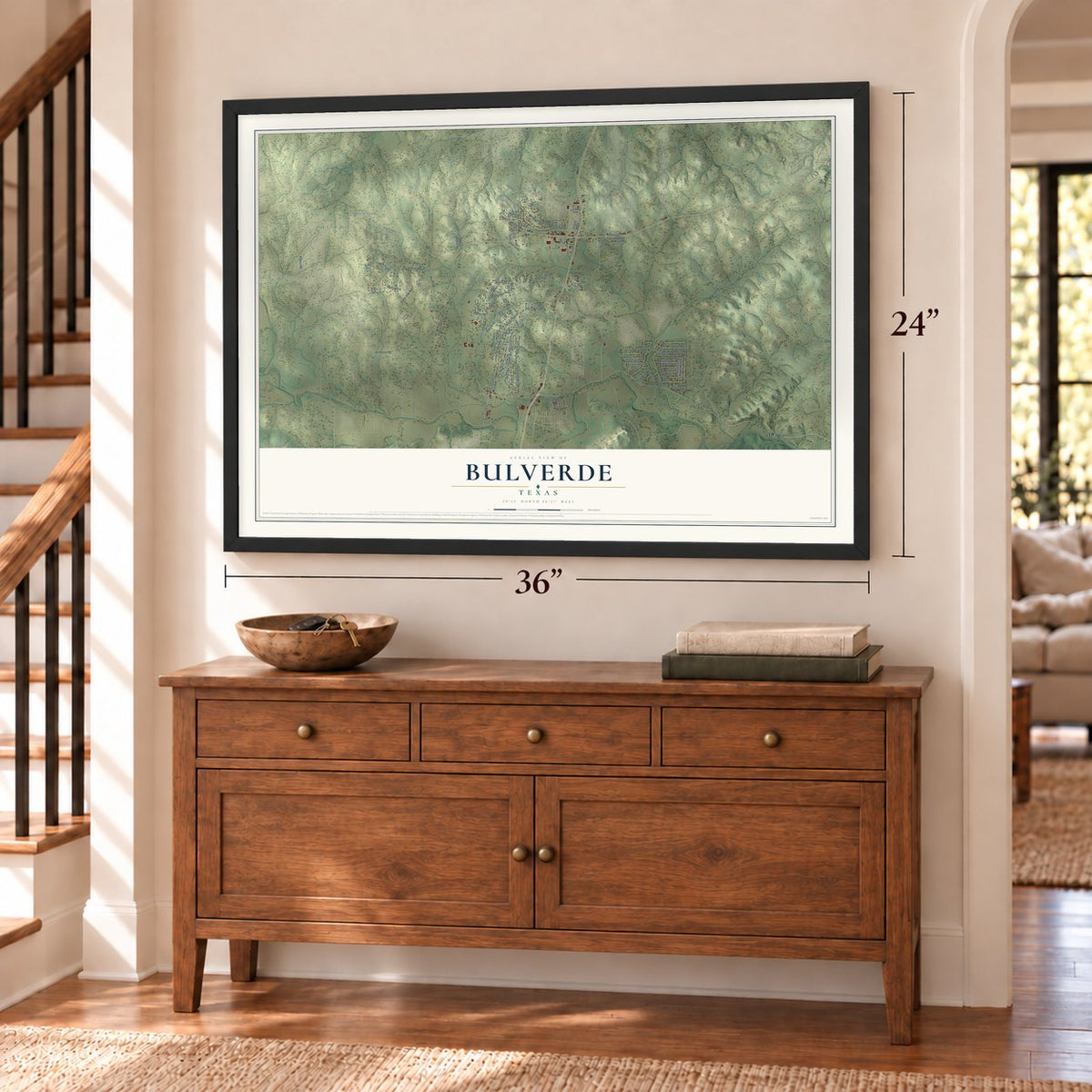 Bulverde, Texas map, 24 x 36 inch print in a black frame above a dresser by a staircase