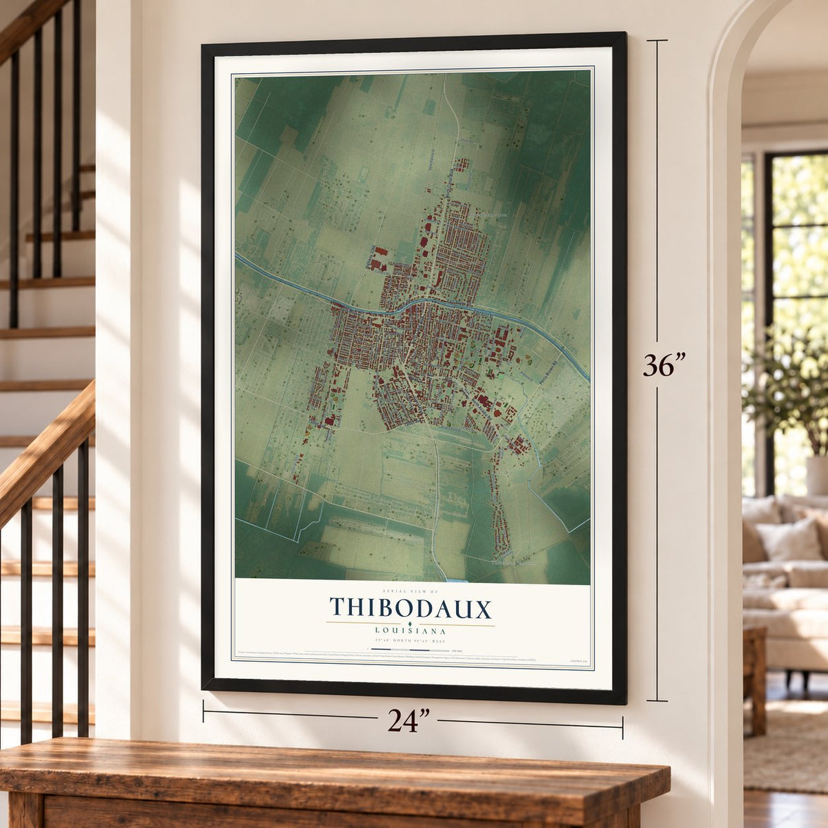 Thibodaux, Louisiana map, 24 x 36 inch print in a black frame by a staircase