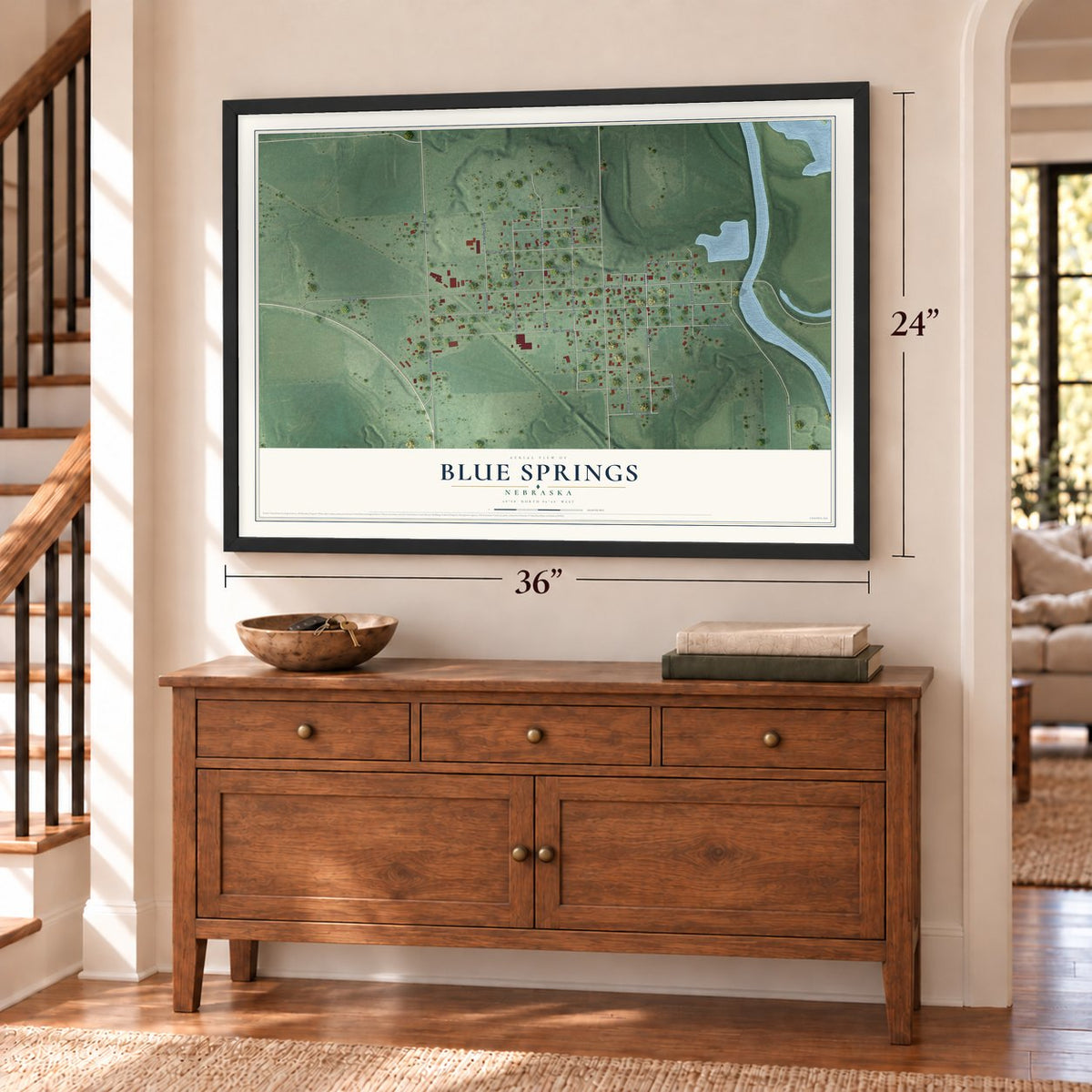 Blue Springs, Nebraska map, 24 x 36 inch print in a black frame above a dresser by a staircase