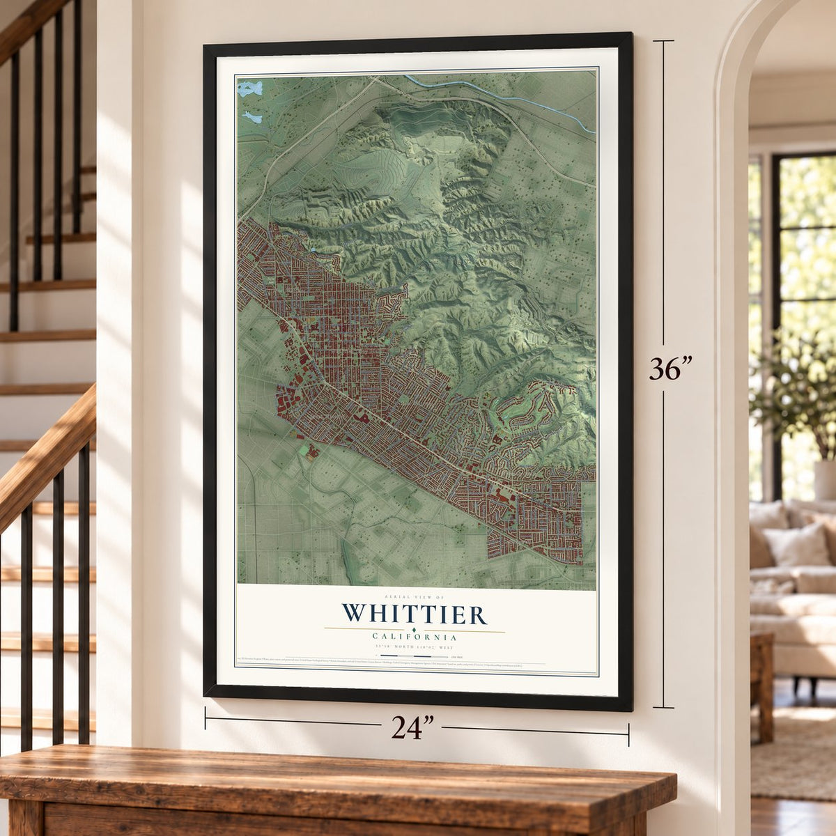 Whittier, California map, 24 x 36 inch print in a black frame by a staircase