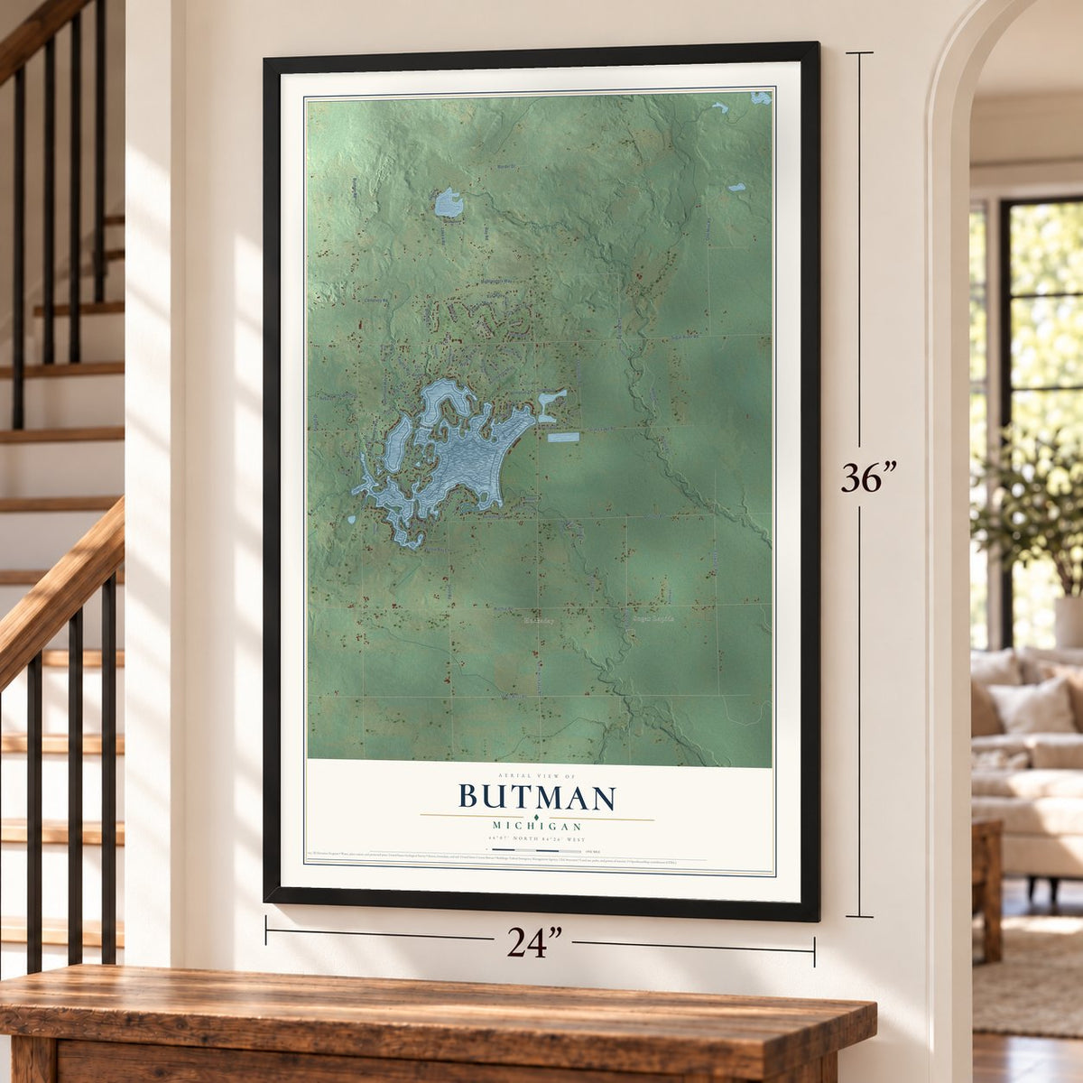 Butman, Michigan map, 24 x 36 inch print in a black frame by a staircase