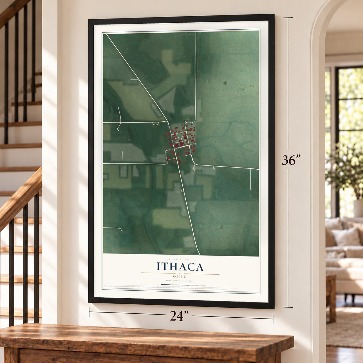 Ithaca, Ohio map, 24 x 36 inch print in a black frame by a staircase