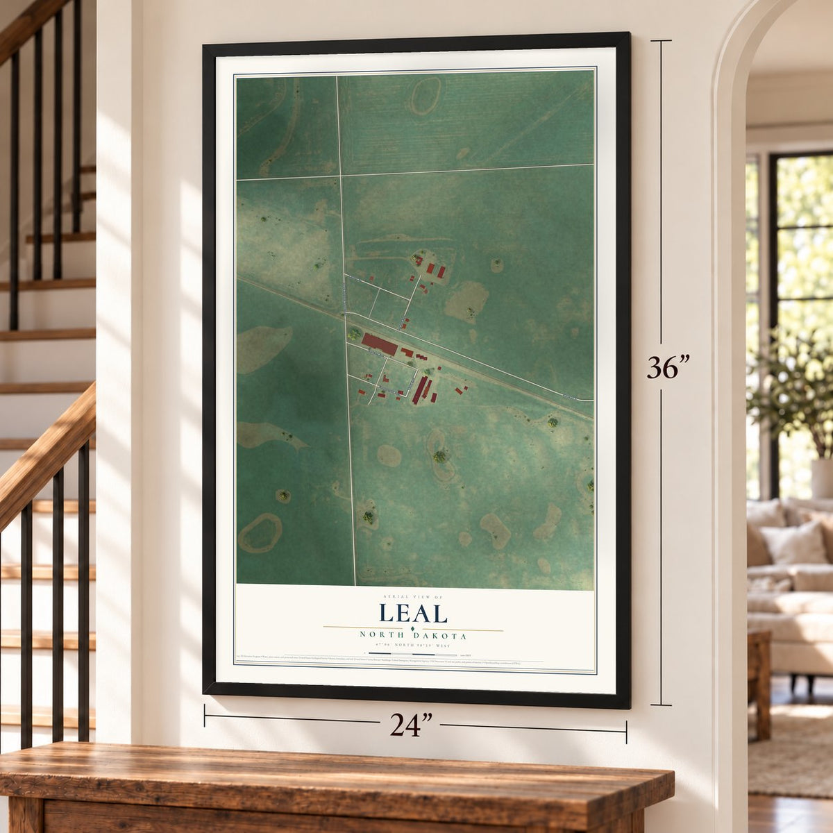 Leal, North Dakota map, 24 x 36 inch print in a black frame by a staircase