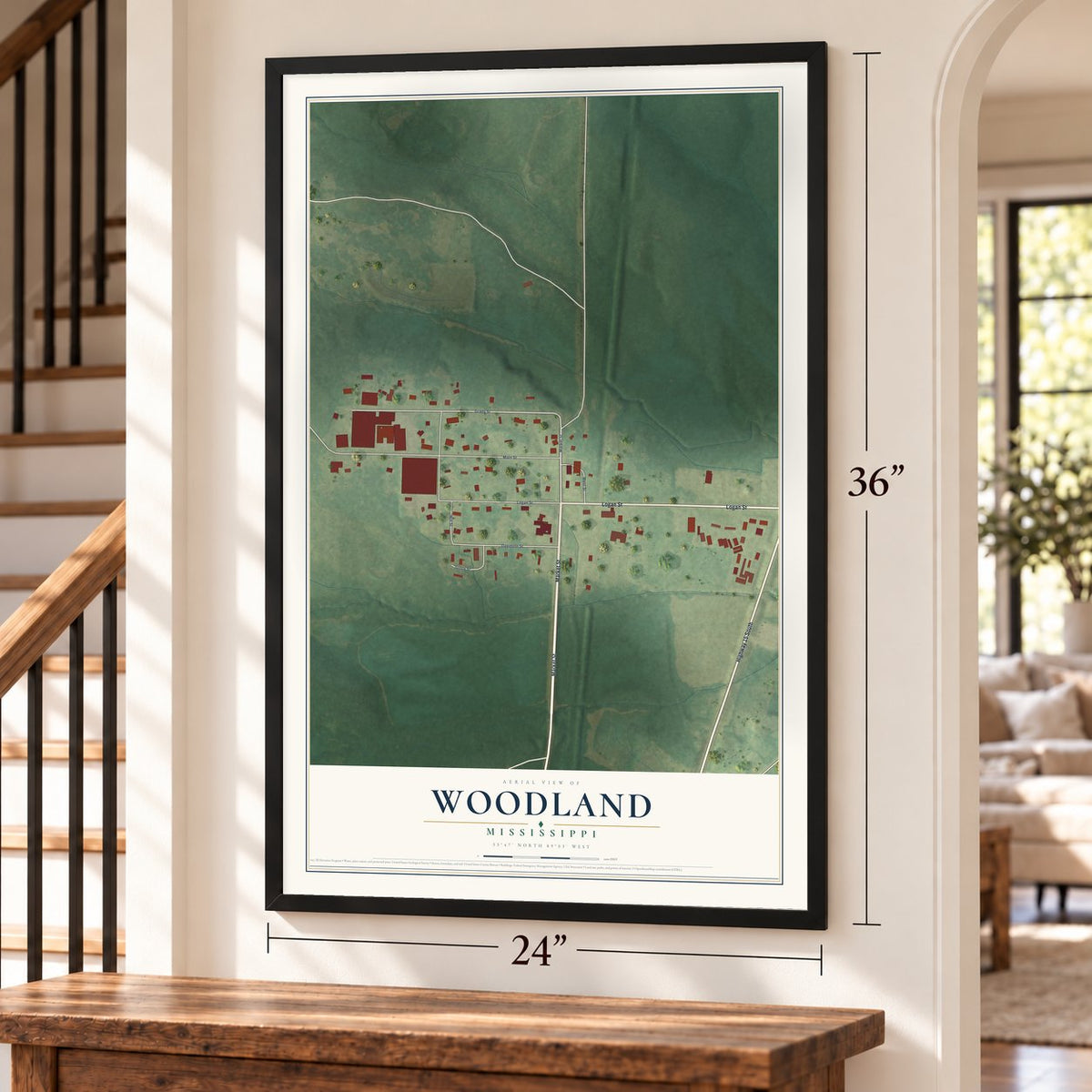 Woodland, Mississippi map, 24 x 36 inch print in a black frame by a staircase