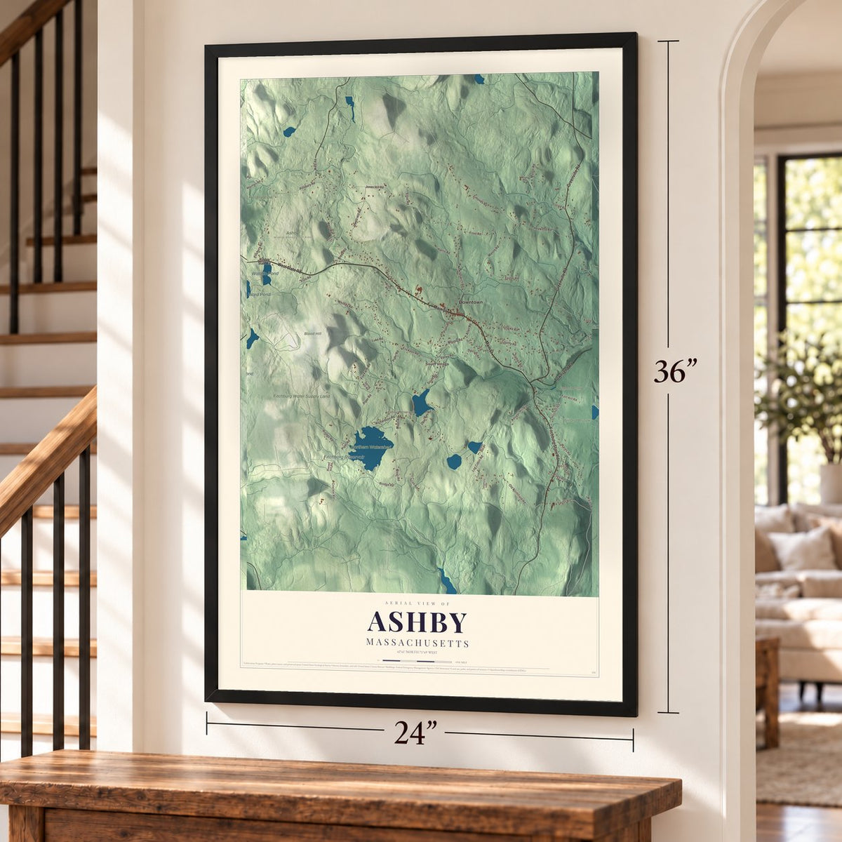Ashby, Massachusetts map, 24 x 36 inch print in a black frame by a staircase