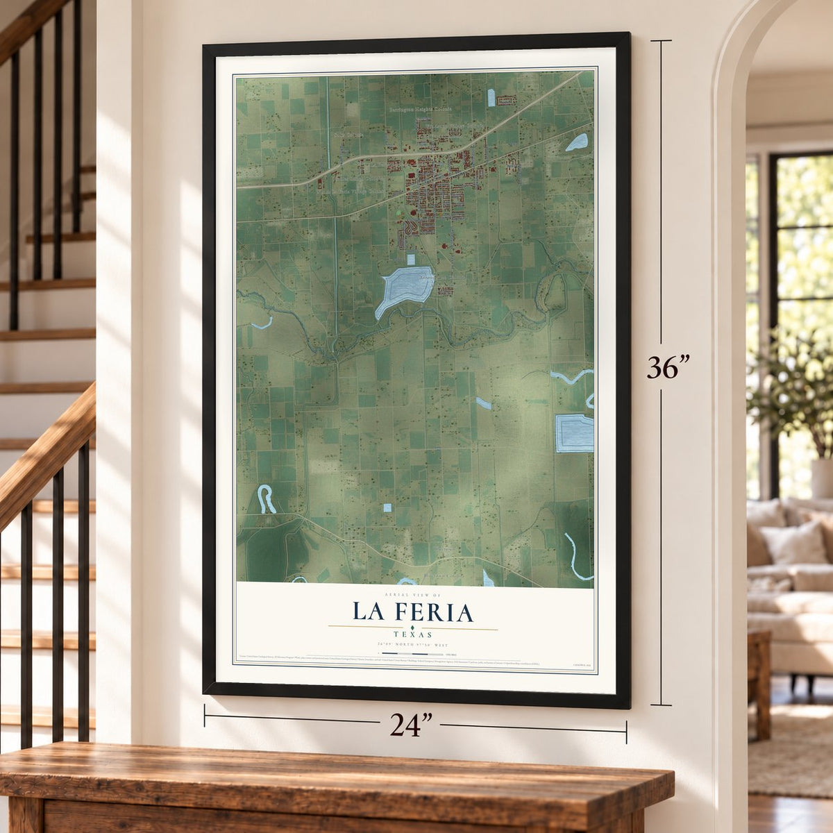 La Feria, Texas map, 24 x 36 inch print in a black frame by a staircase