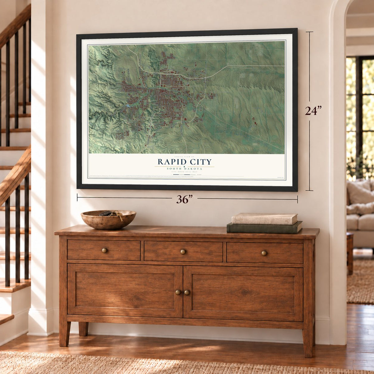 Rapid City, South Dakota map, 24 x 36 inch print in a black frame above a dresser by a staircase