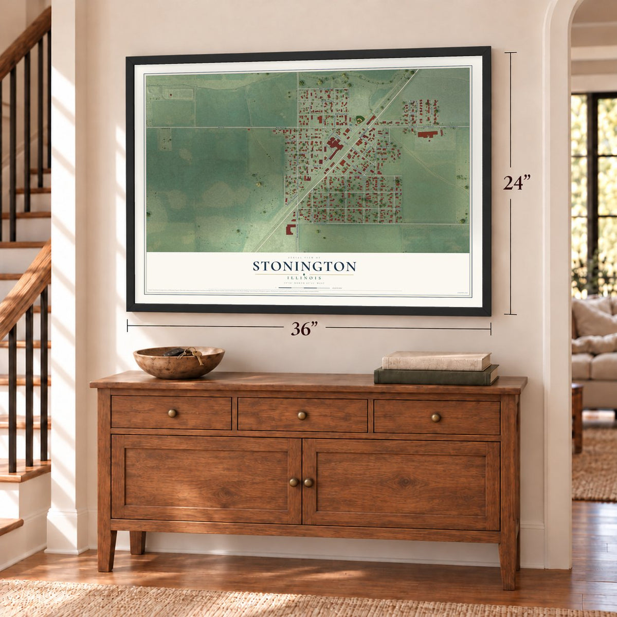 Stonington, Illinois map, 24 x 36 inch print in a black frame above a dresser by a staircase