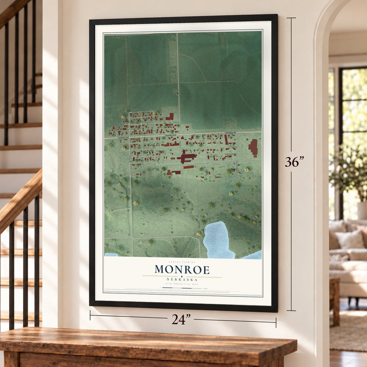 Monroe, Nebraska map, 24 x 36 inch print in a black frame by a staircase