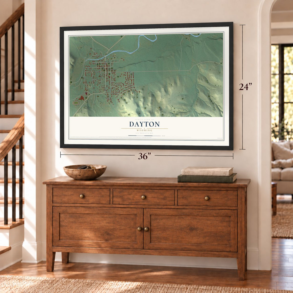 Dayton, Wyoming map, 24 x 36 inch print in a black frame above a dresser by a staircase