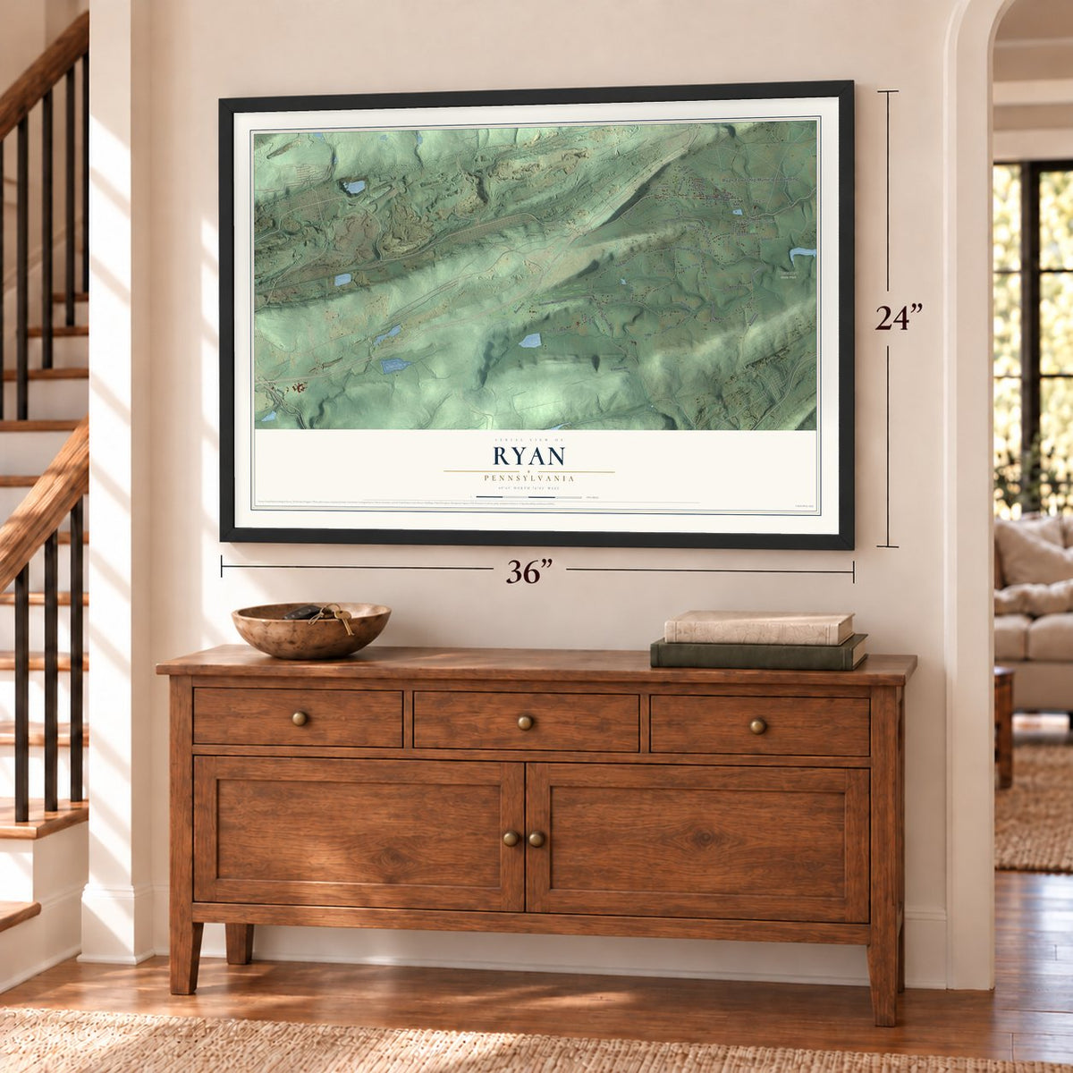 Ryan, Pennsylvania map, 24 x 36 inch print in a black frame above a dresser by a staircase
