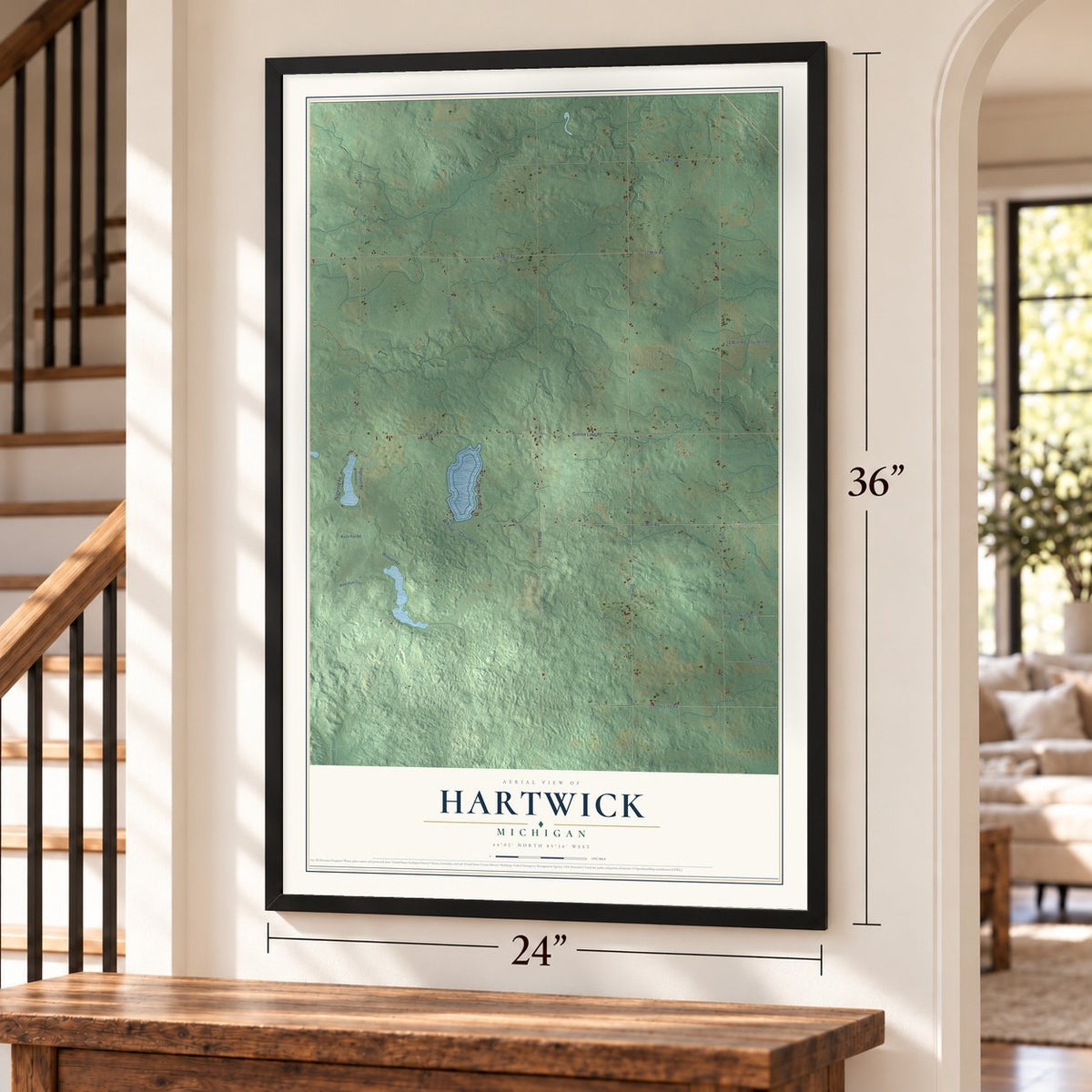 Hartwick, Michigan map, 24 x 36 inch print in a black frame by a staircase