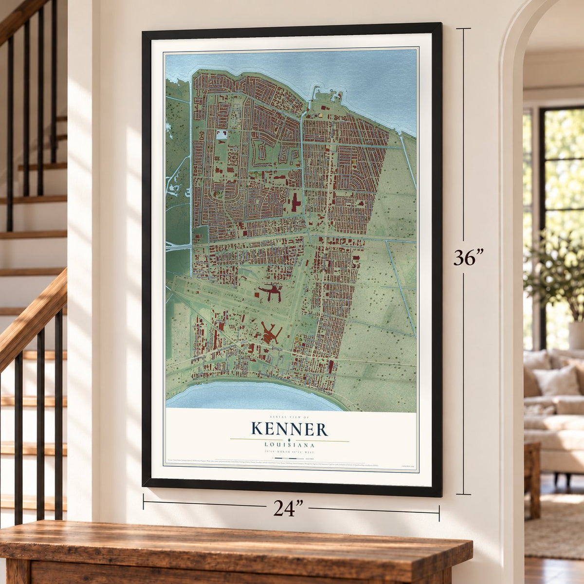 Kenner, Louisiana map, 24 x 36 inch print in a black frame by a staircase