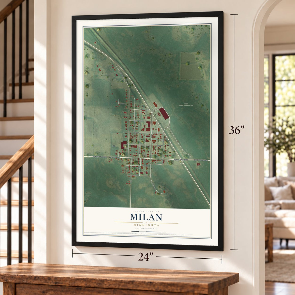 Milan, Minnesota map, 24 x 36 inch print in a black frame by a staircase