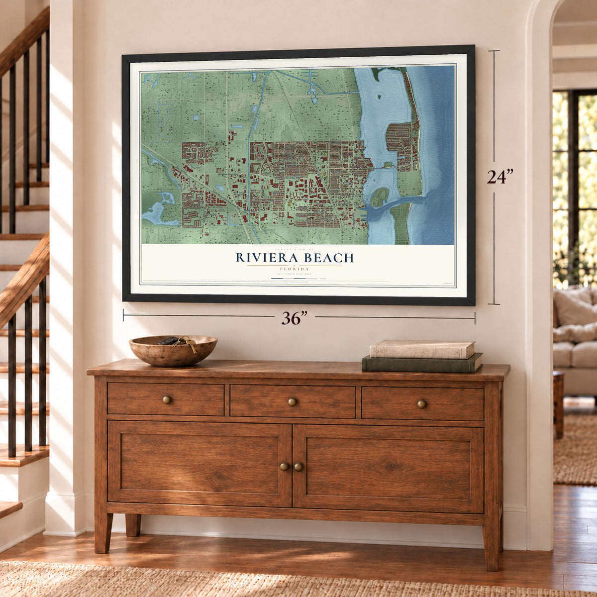 Riviera Beach, Florida map, 24 x 36 inch print in a black frame above a dresser by a staircase