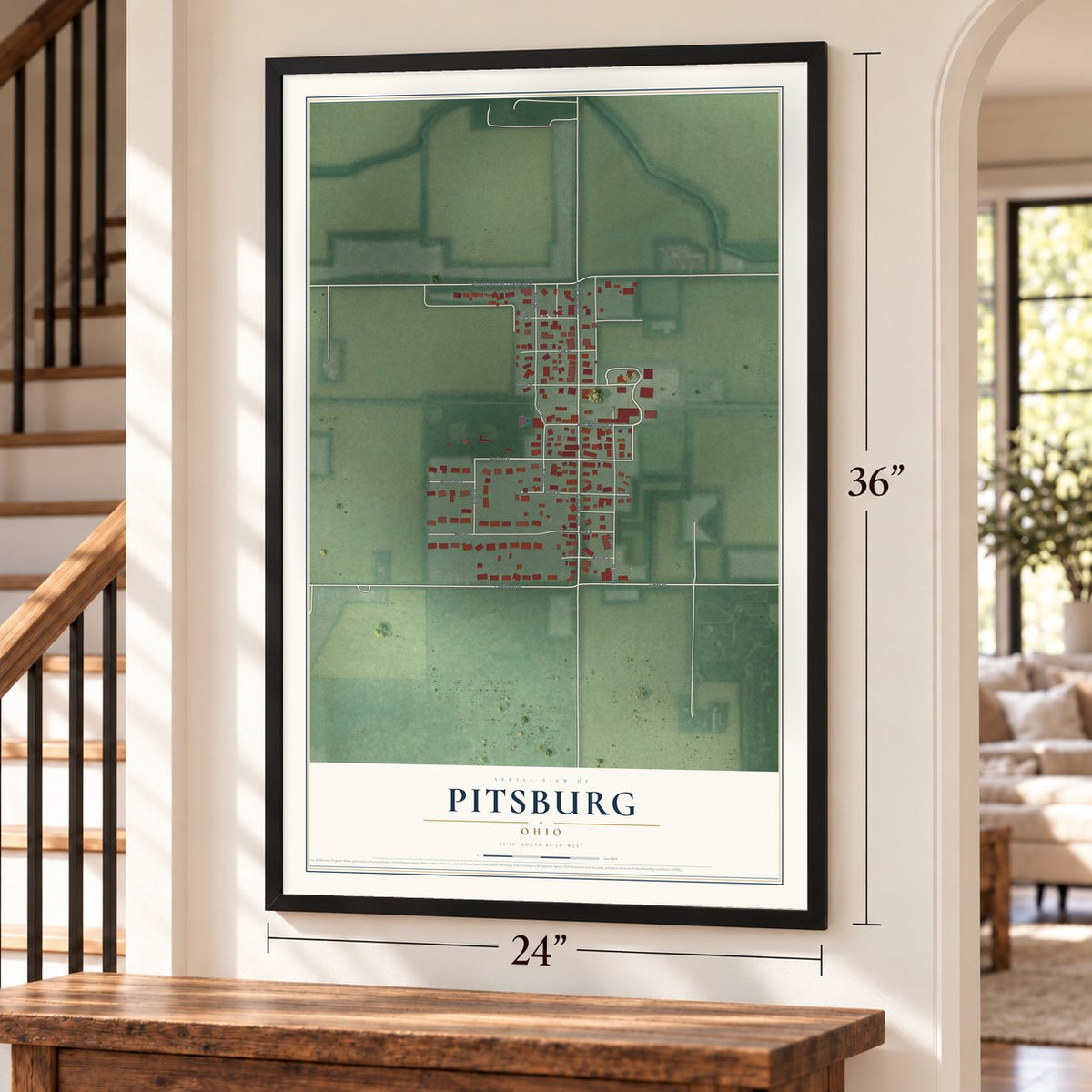 Pitsburg, Ohio map, 24 x 36 inch print in a black frame by a staircase