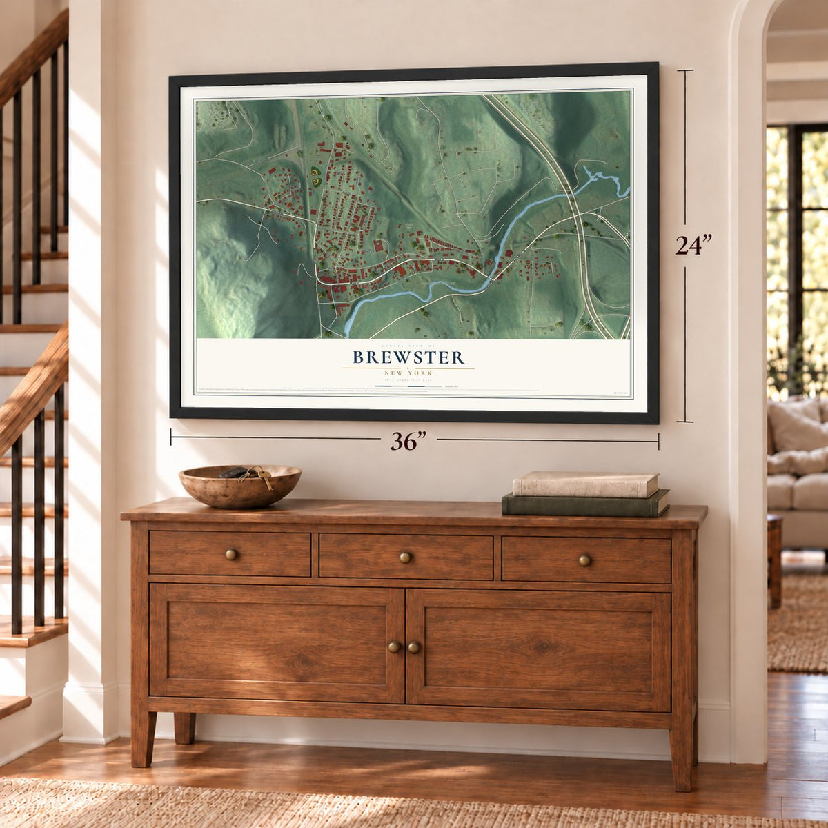 Brewster, New York map, 24 x 36 inch print in a black frame above a dresser by a staircase