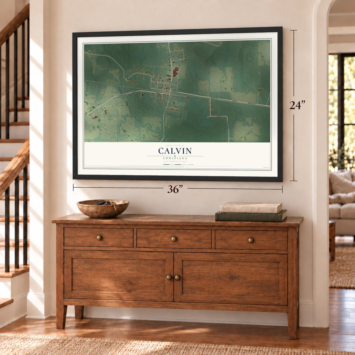Calvin, Louisiana map, 24 x 36 inch print in a black frame above a dresser by a staircase
