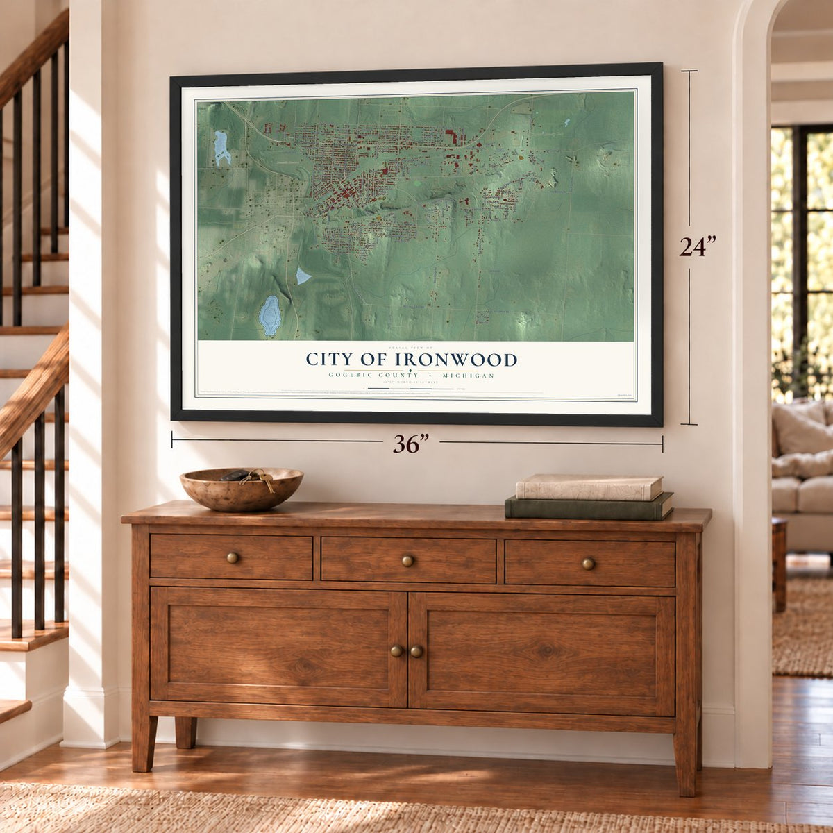 Ironwood, Michigan map, 24 x 36 inch print in a black frame above a dresser by a staircase