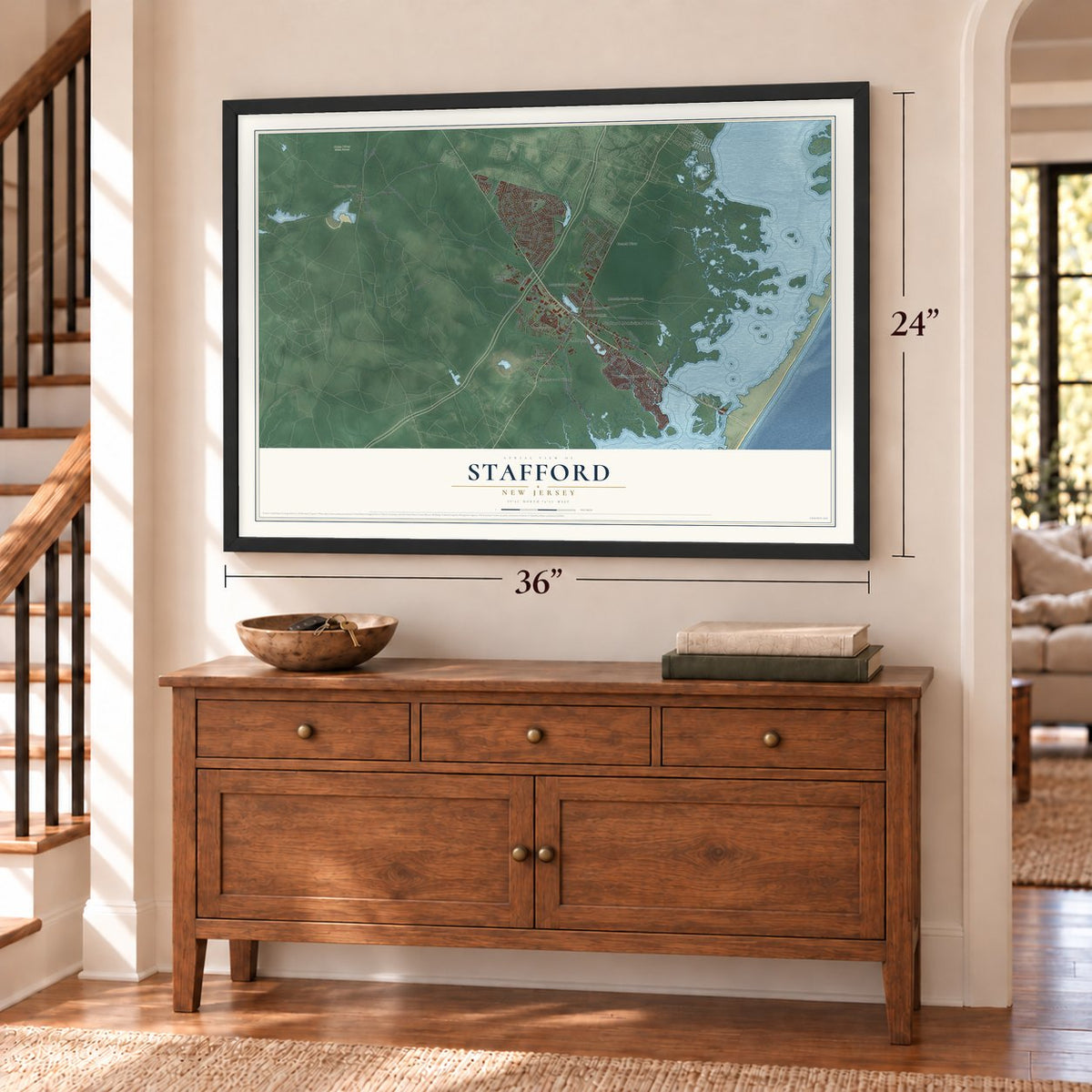 Stafford, New Jersey map, 24 x 36 inch print in a black frame above a dresser by a staircase