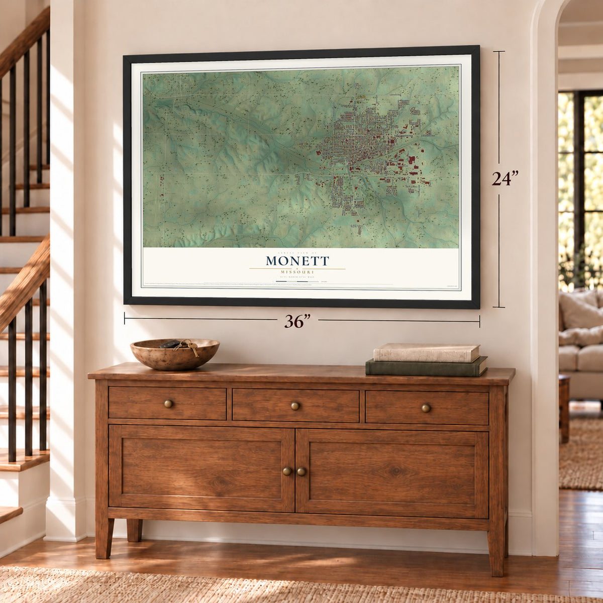 Monett, Missouri map, 24 x 36 inch print in a black frame above a dresser by a staircase