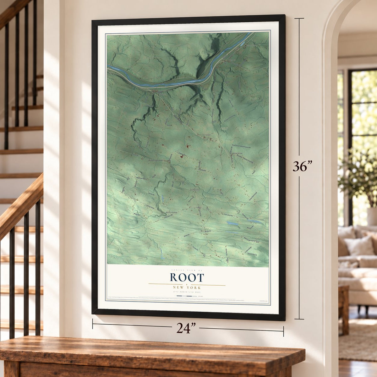 Root, New York map, 24 x 36 inch print in a black frame by a staircase