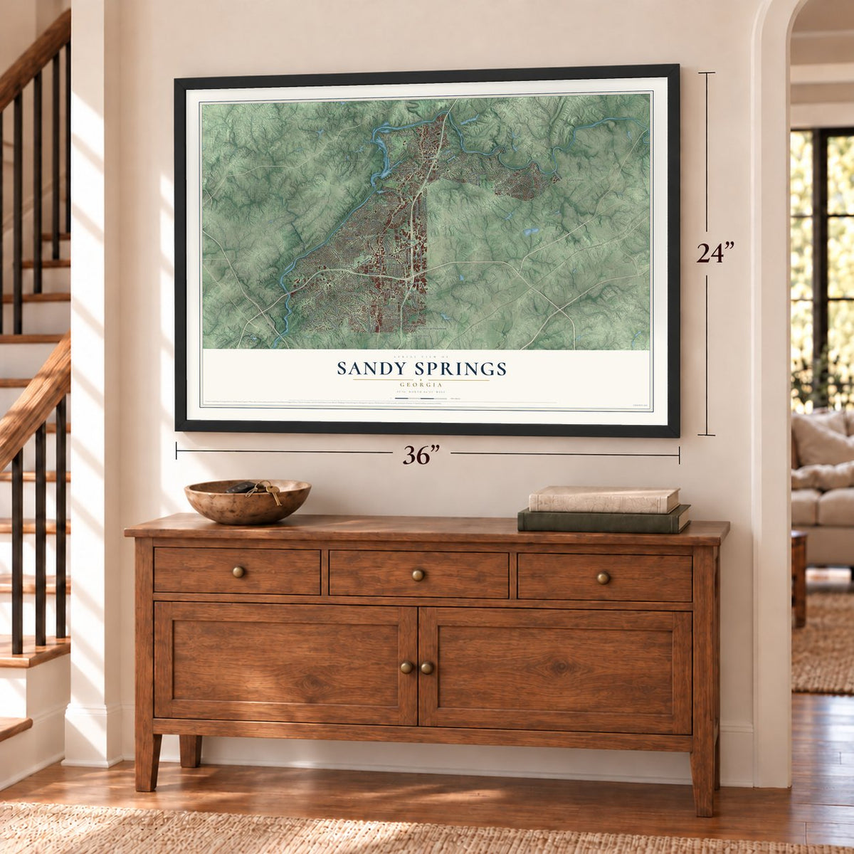 Sandy Springs, Georgia map, 24 x 36 inch print in a black frame above a dresser by a staircase