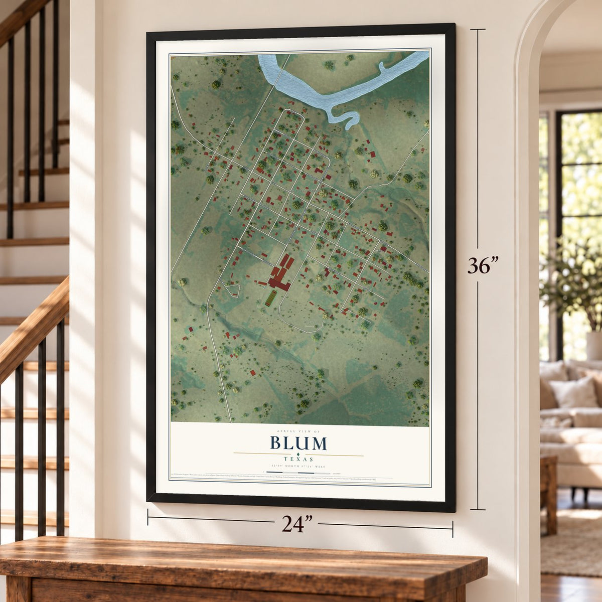Blum, Texas map, 24 x 36 inch print in a black frame by a staircase