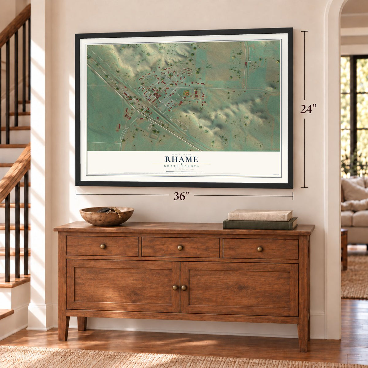 Rhame, North Dakota map, 24 x 36 inch print in a black frame above a dresser by a staircase