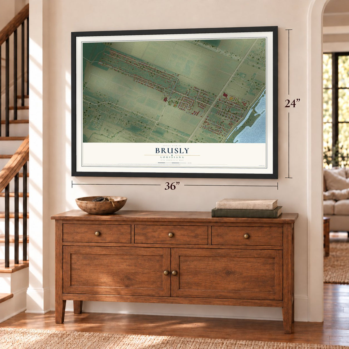 Brusly, Louisiana map, 24 x 36 inch print in a black frame above a dresser by a staircase