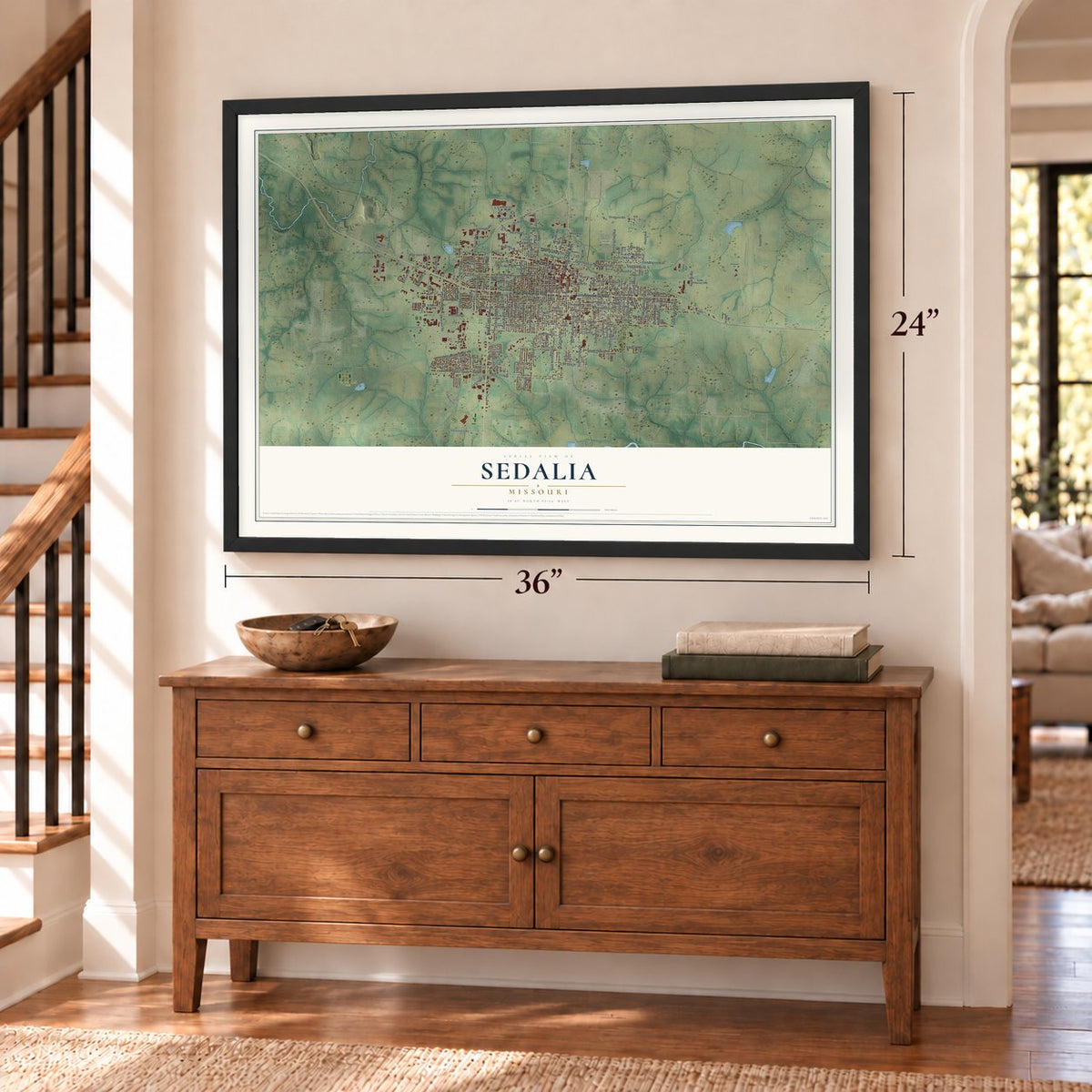 Sedalia, Missouri map, 24 x 36 inch print in a black frame above a dresser by a staircase