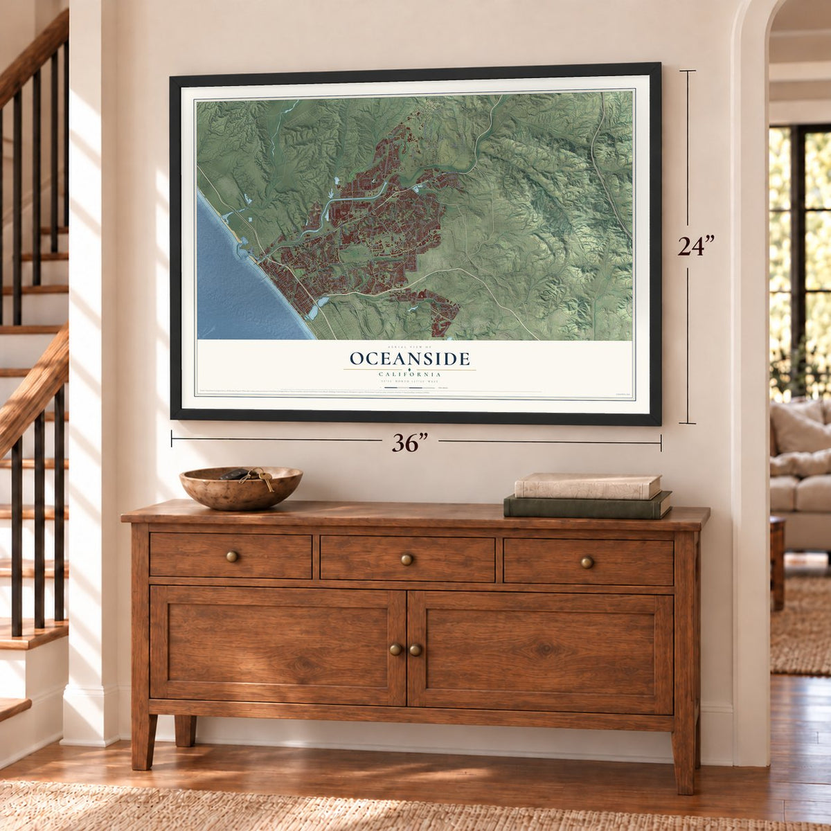 Oceanside, California map, 24 x 36 inch print in a black frame above a dresser by a staircase