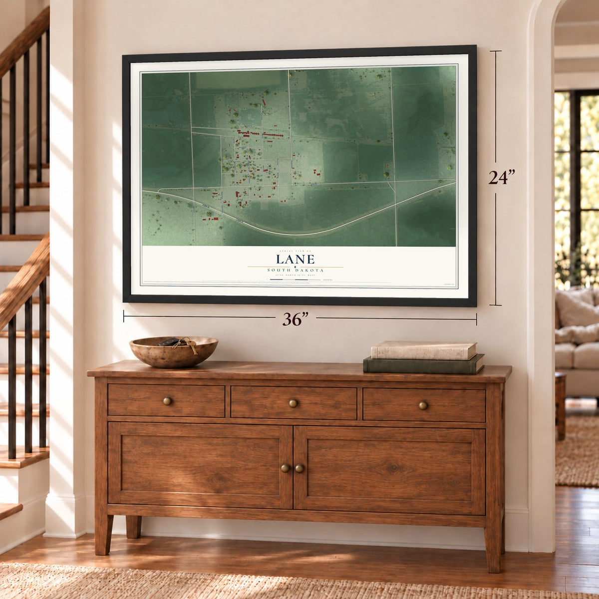 Lane, South Dakota map, 24 x 36 inch print in a black frame above a dresser by a staircase