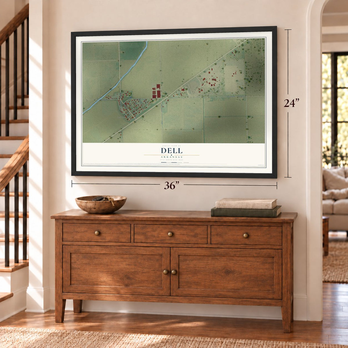 Dell, Arkansas map, 24 x 36 inch print in a black frame above a dresser by a staircase