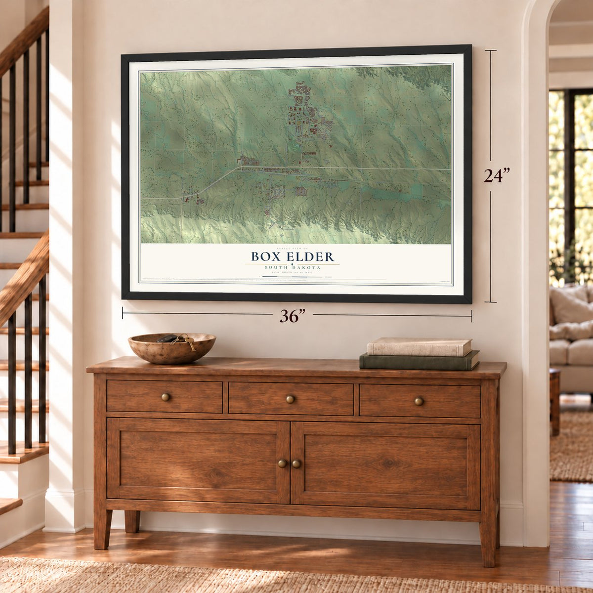 Box Elder, South Dakota map, 24 x 36 inch print in a black frame above a dresser by a staircase