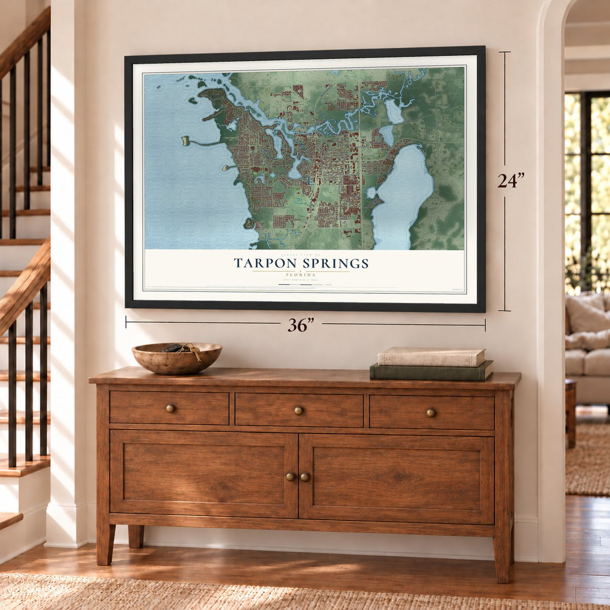 Tarpon Springs, Florida map, 24 x 36 inch print in a black frame above a dresser by a staircase