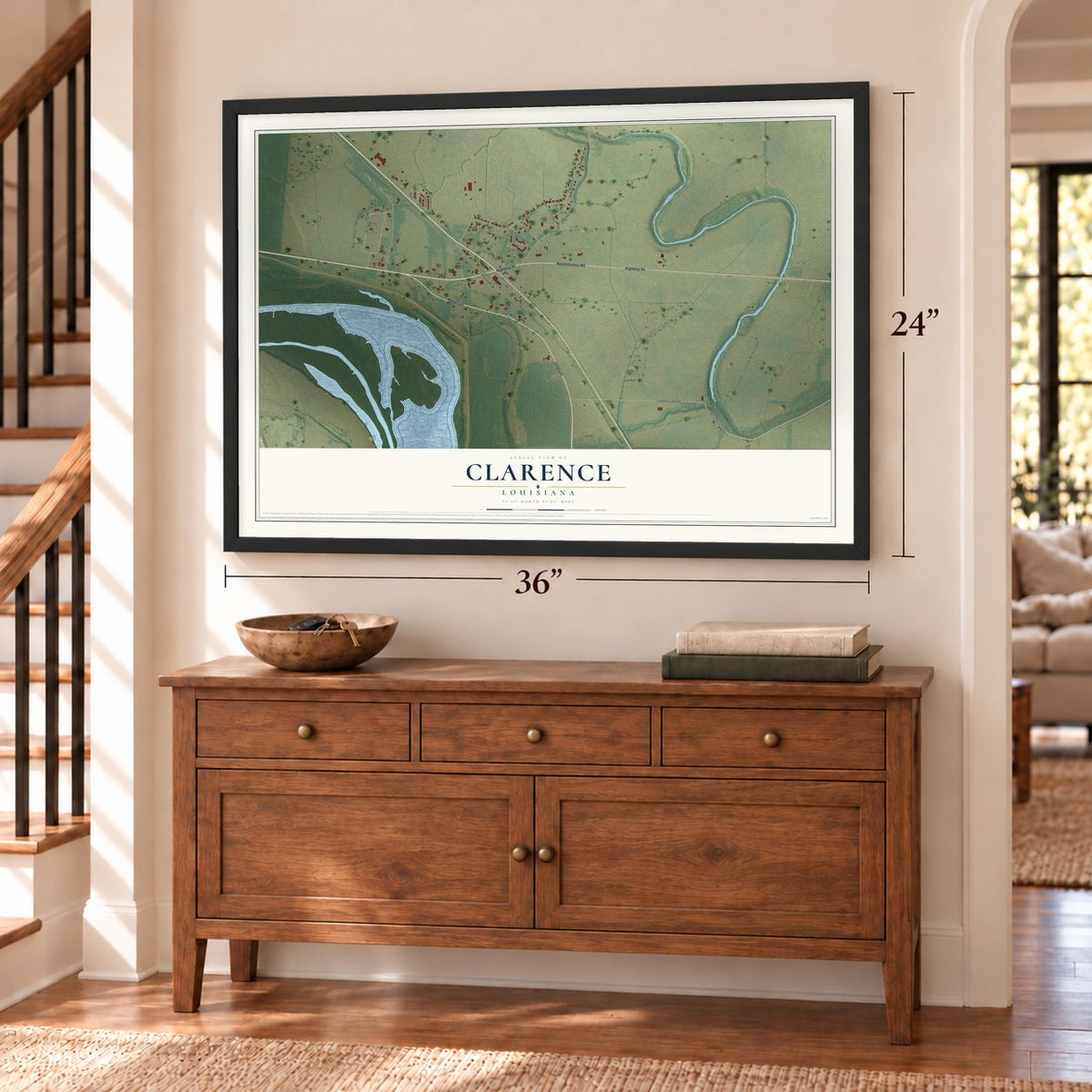 Clarence, Louisiana map, 24 x 36 inch print in a black frame above a dresser by a staircase