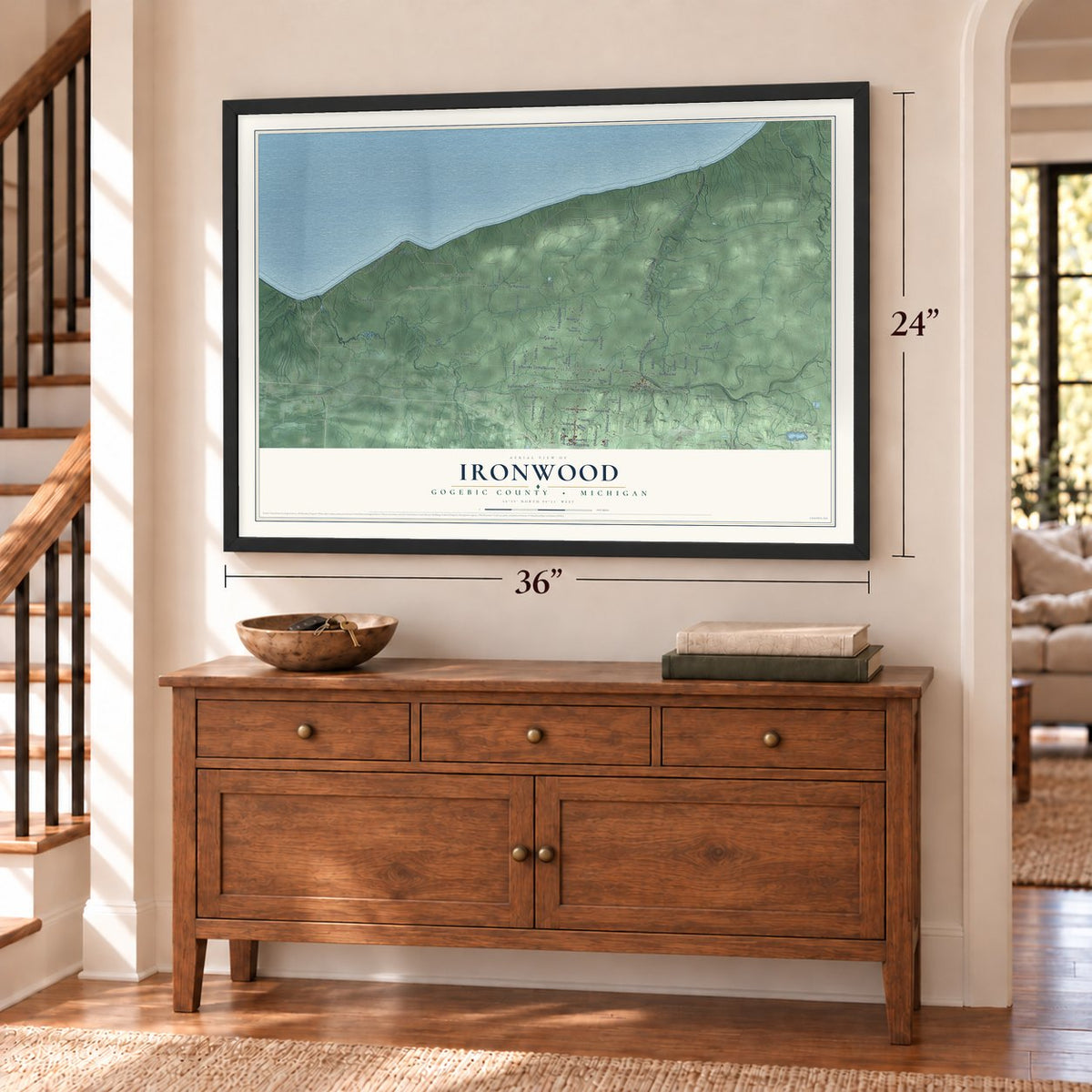 Ironwood, Gogebic County, Michigan map, 24 x 36 inch print in a black frame above a dresser by a staircase