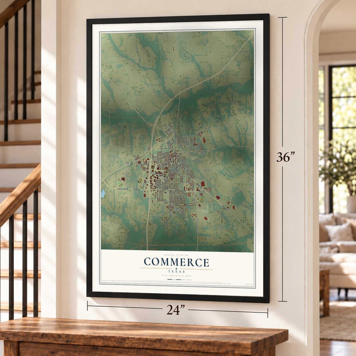 Commerce, Texas map, 24 x 36 inch print in a black frame by a staircase