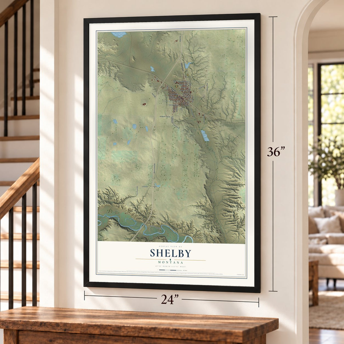 Shelby, Montana map, 24 x 36 inch print in a black frame by a staircase