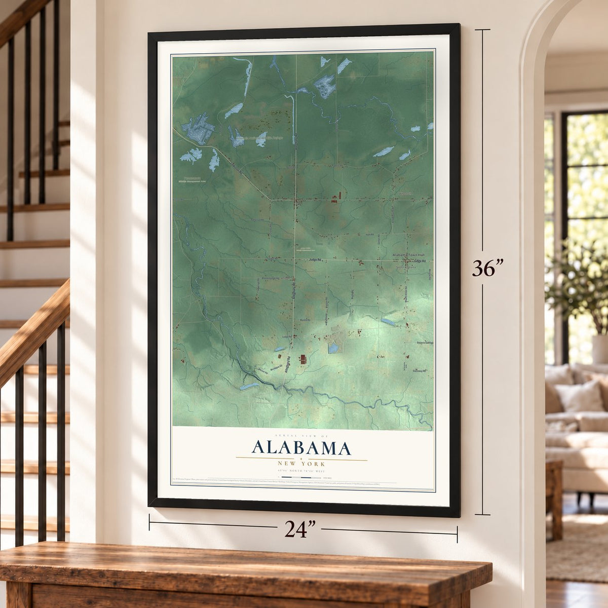 Alabama, New York map, 24 x 36 inch print in a black frame by a staircase