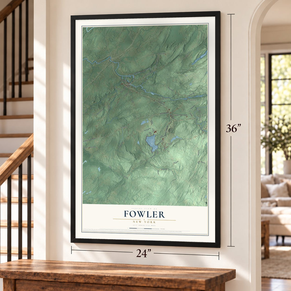 Fowler, New York map, 24 x 36 inch print in a black frame by a staircase