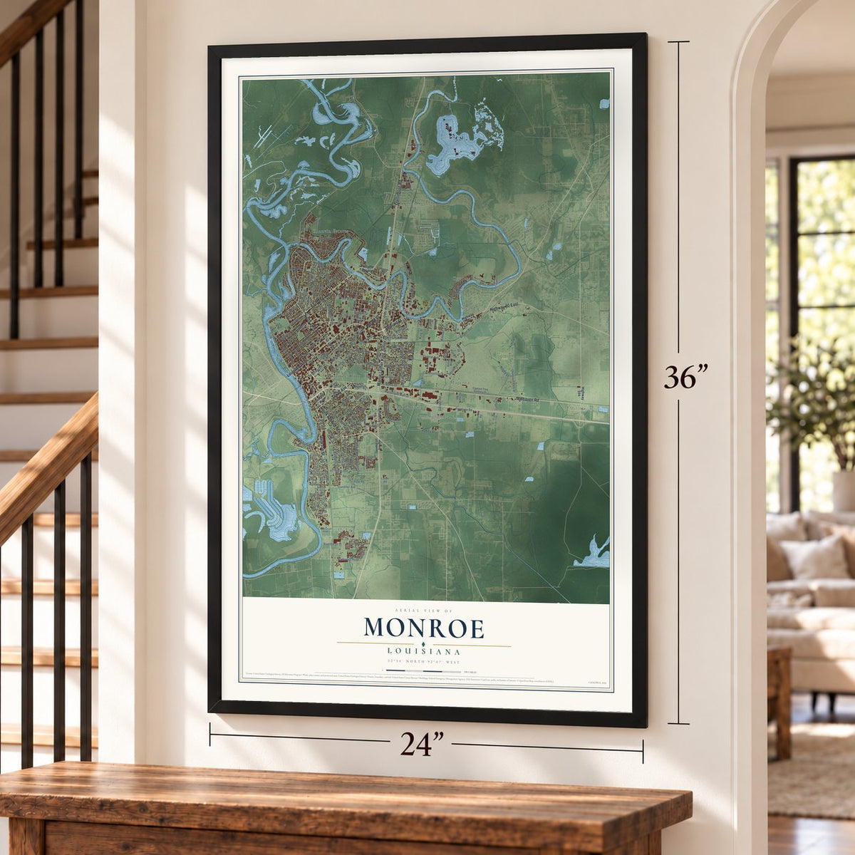 Monroe, Louisiana map, 24 x 36 inch print in a black frame by a staircase