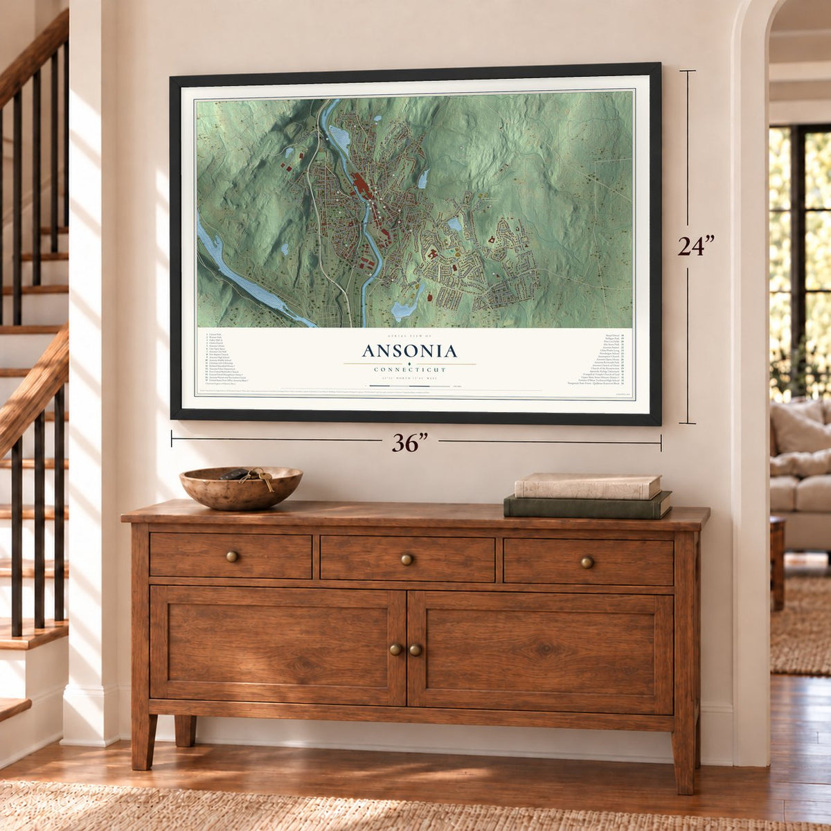 Ansonia, Connecticut map, 24 x 36 inch print in a black frame above a dresser by a staircase