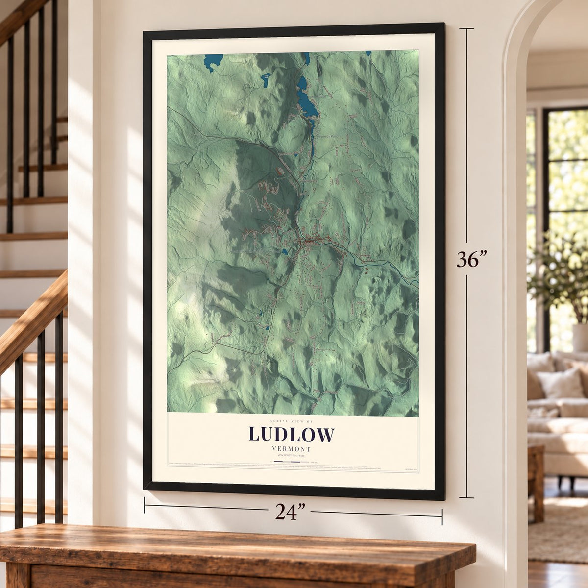 Ludlow, Vermont map, 24 x 36 inch print in a black frame by a staircase