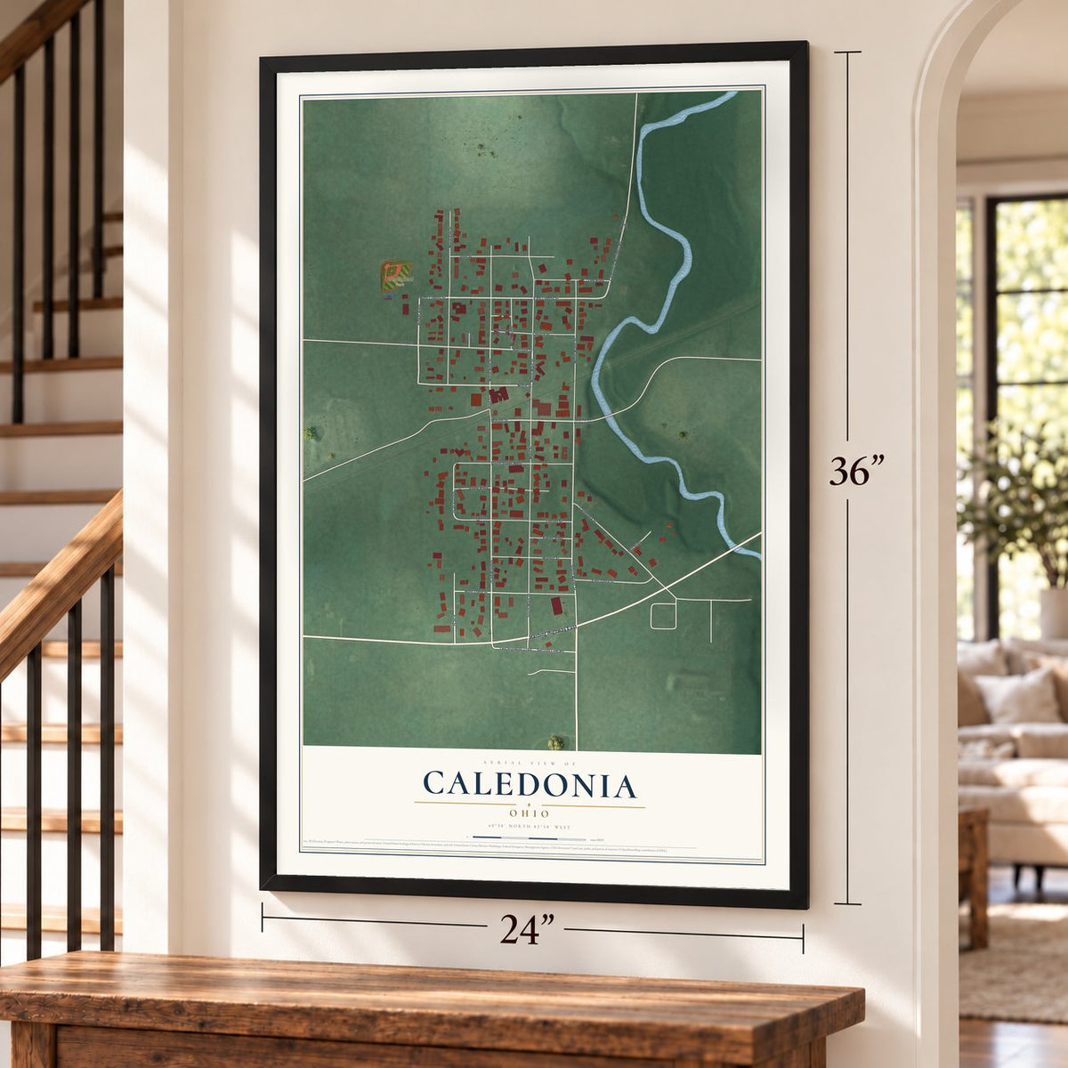 Caledonia, Ohio map, 24 x 36 inch print in a black frame by a staircase