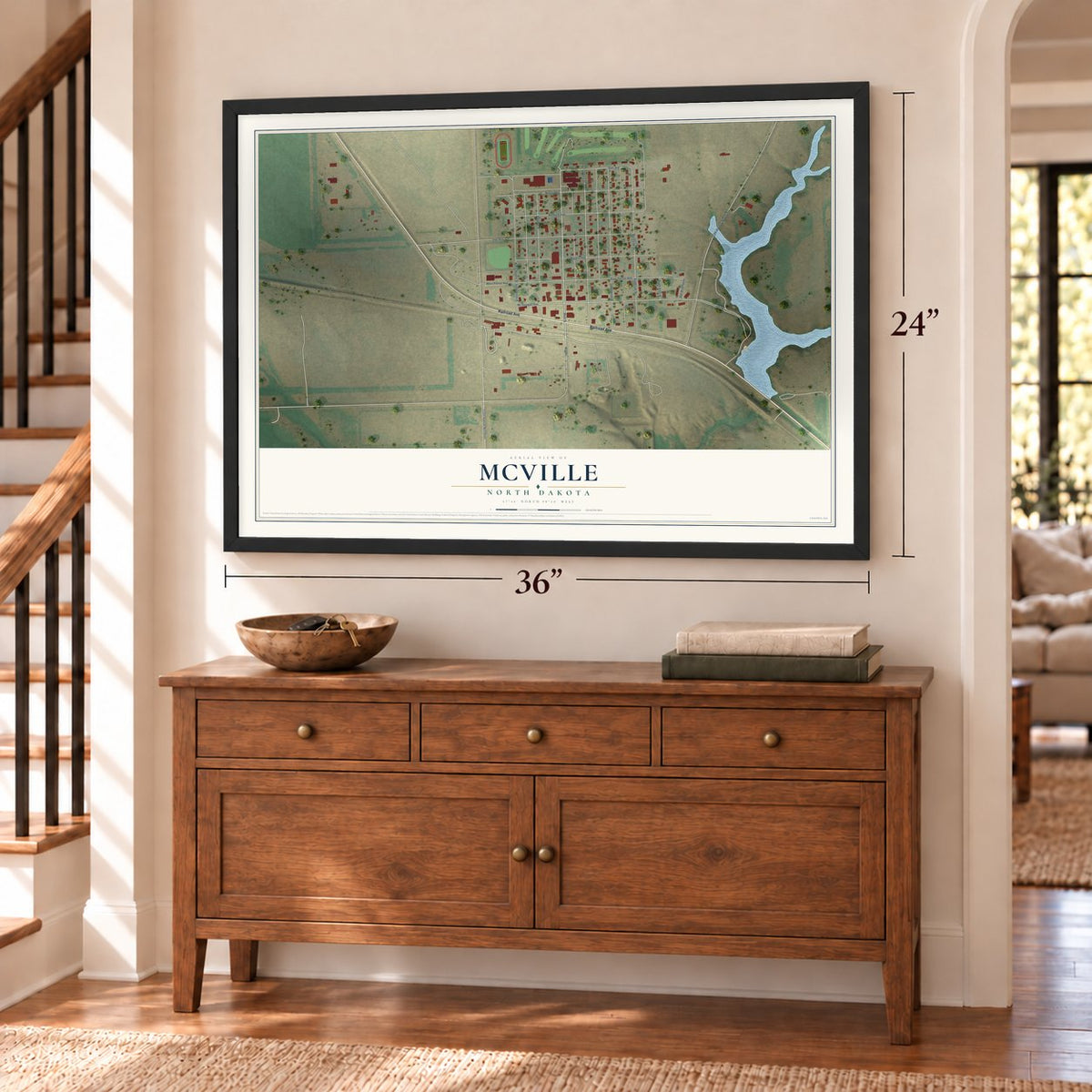 McVille, North Dakota map, 24 x 36 inch print in a black frame above a dresser by a staircase