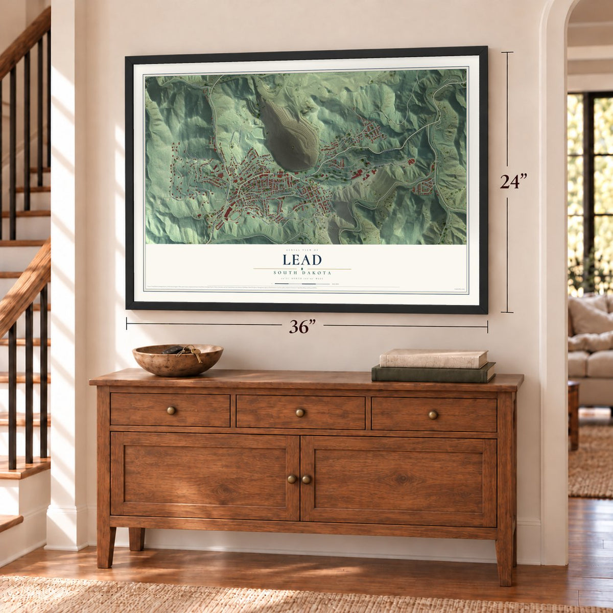 Lead, South Dakota map, 24 x 36 inch print in a black frame above a dresser by a staircase