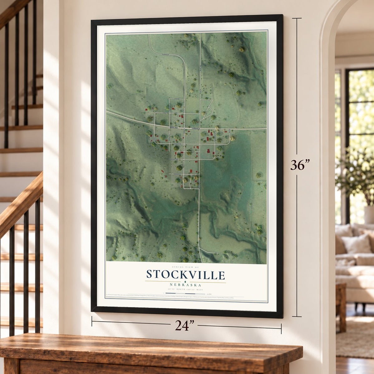 Stockville, Nebraska map, 24 x 36 inch print in a black frame by a staircase