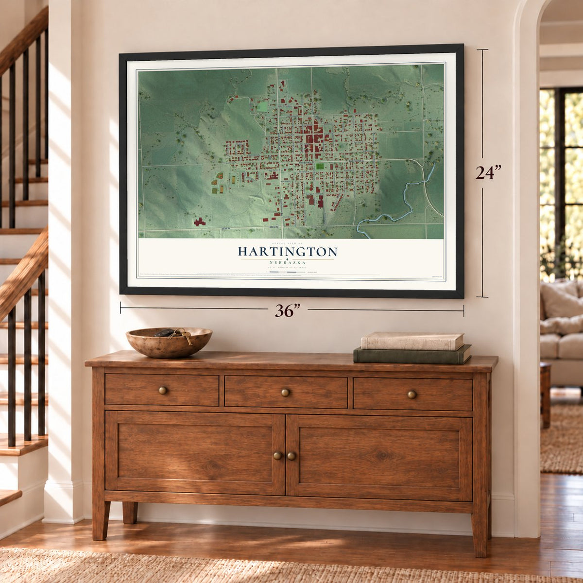Hartington, Nebraska map, 24 x 36 inch print in a black frame above a dresser by a staircase